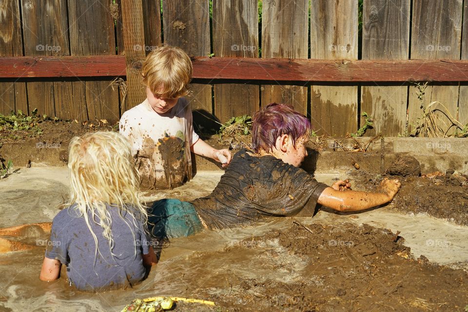 Kids Playing In Mud