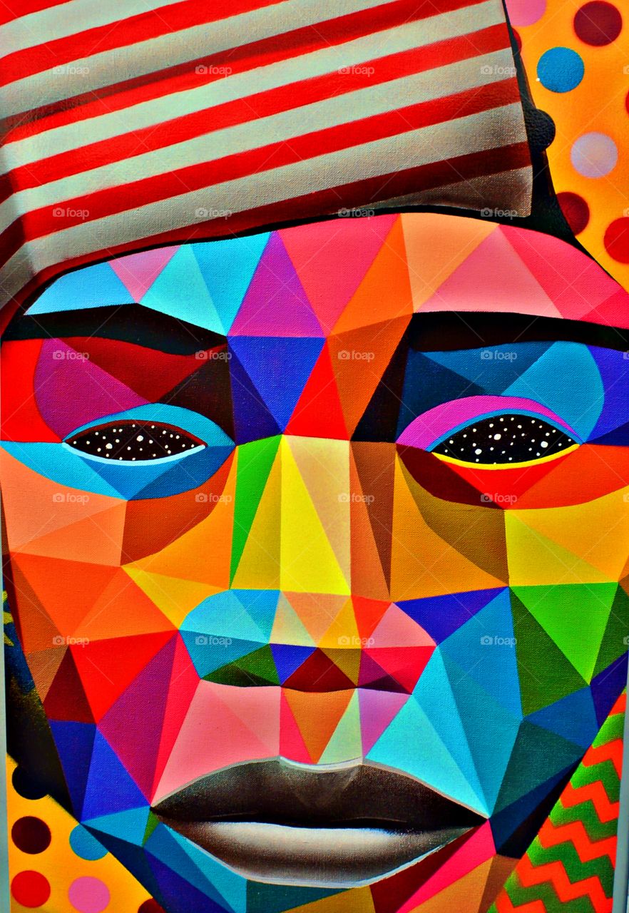 Clash of colors - The face of multiple abstract figures and colors represents the population of the world