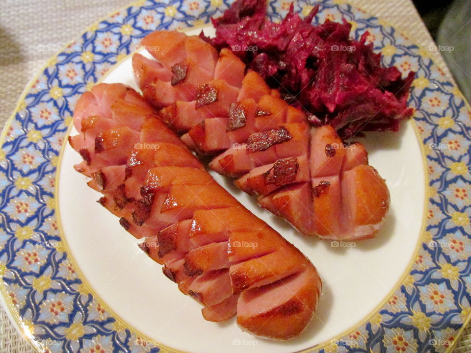 Food on a plate. fried sausages with mashed potatoes, salad