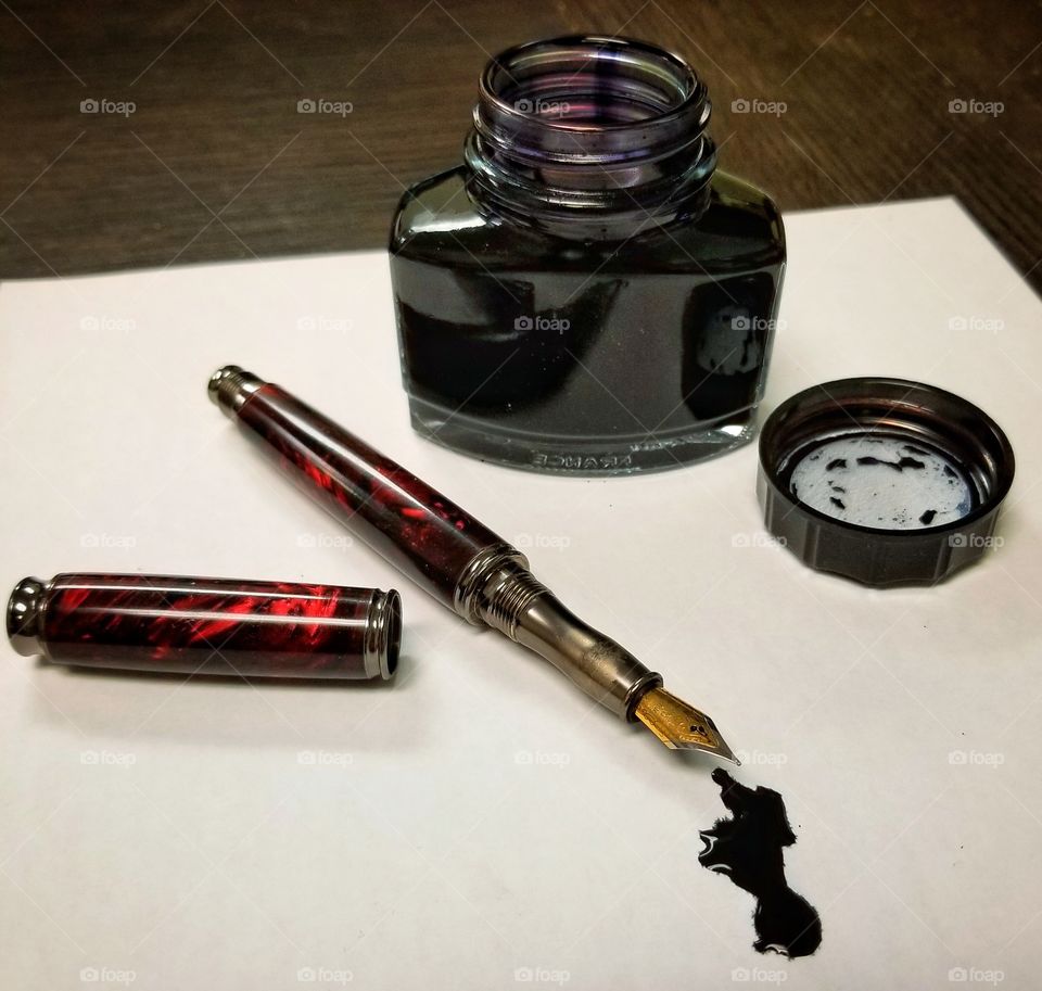 fountain pen with black ink spill