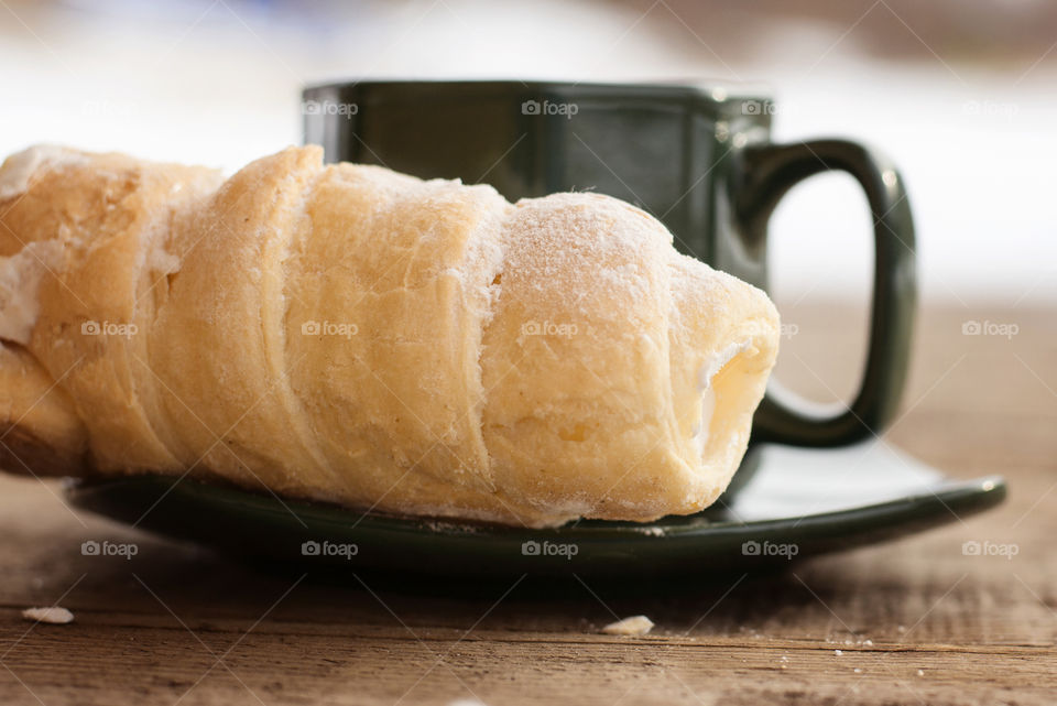 Close-up of napoleon and tea