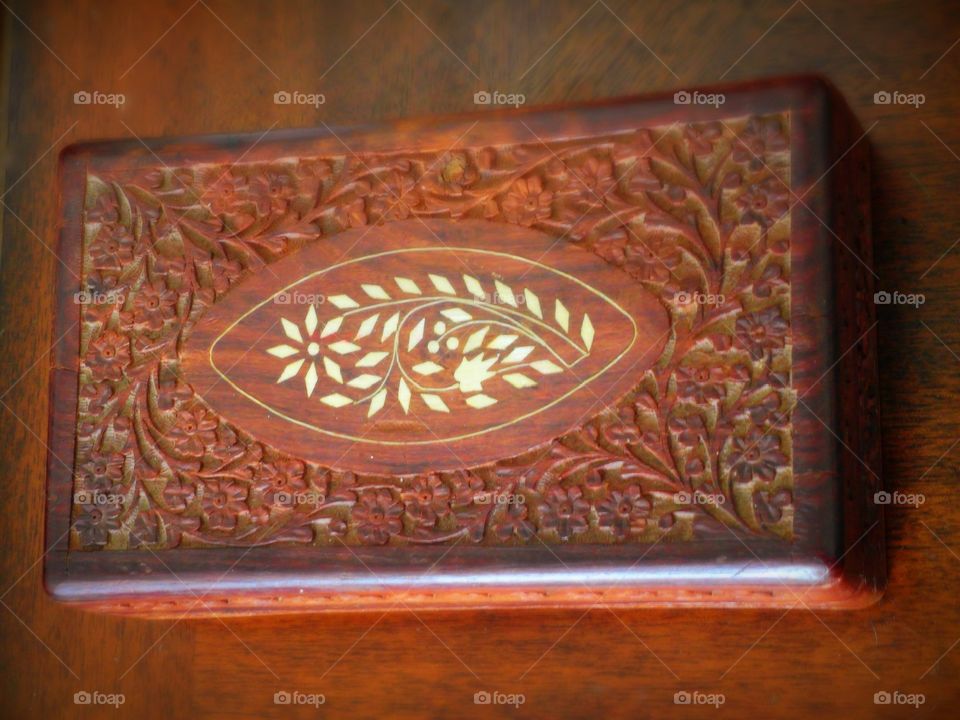 An old wooden jewelry box