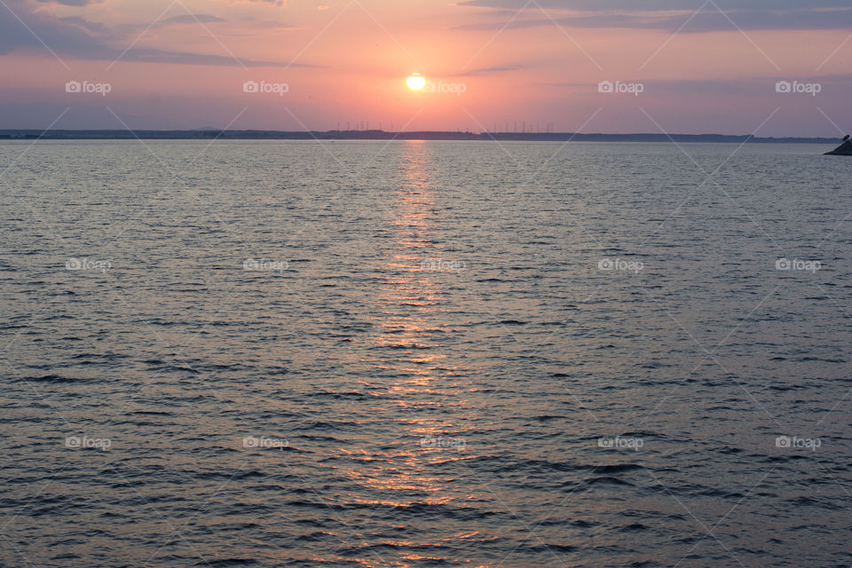 sunrise reflection. colorful sunrise with reflection in the sea