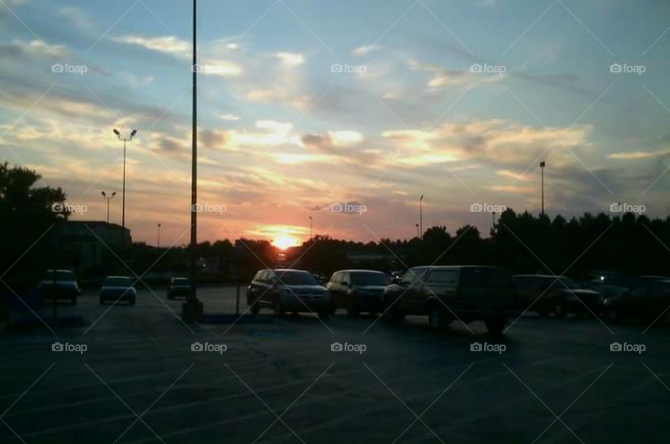 sunset over a parking lot