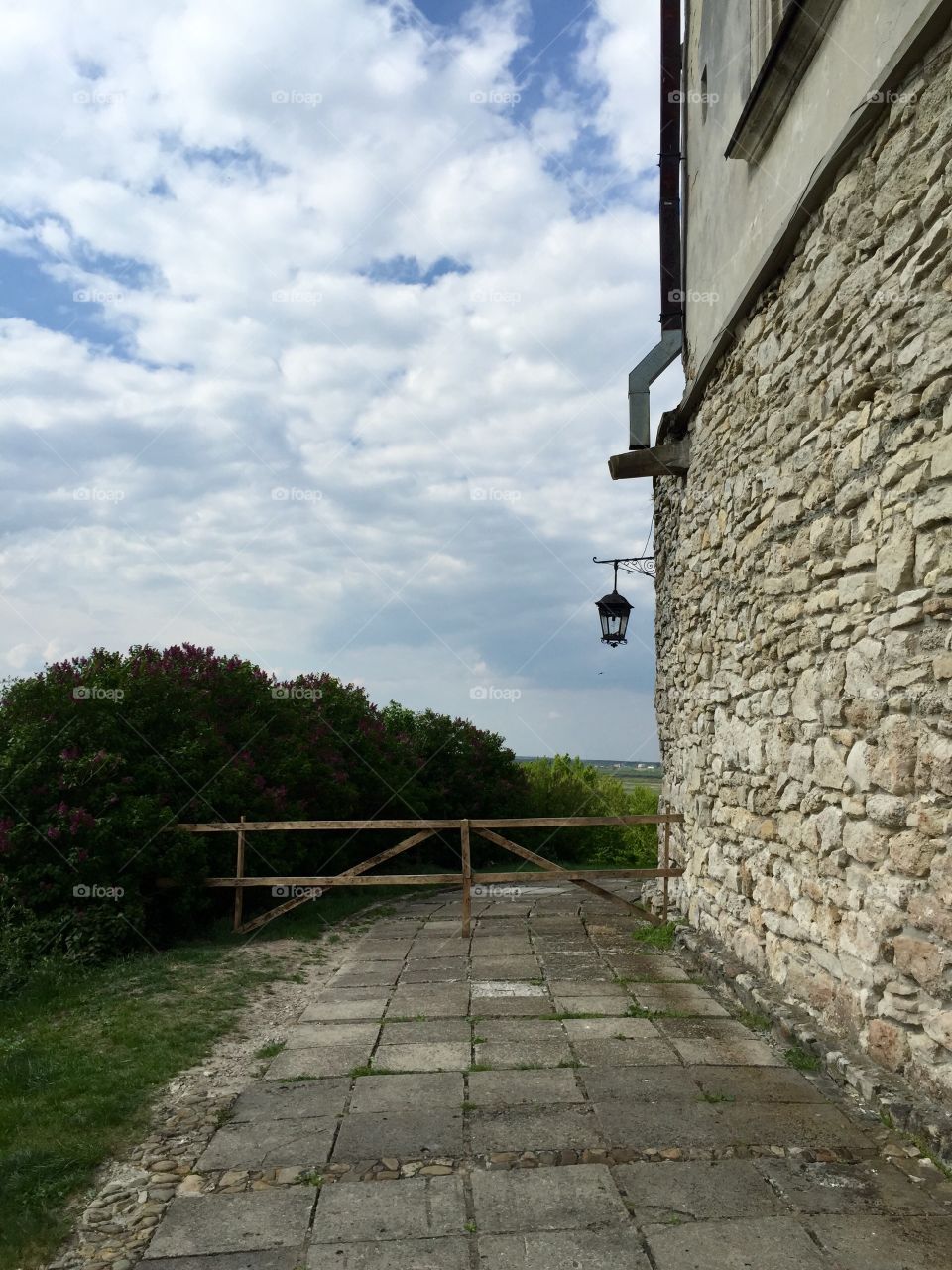 A lantern on a closed walkway in a castle