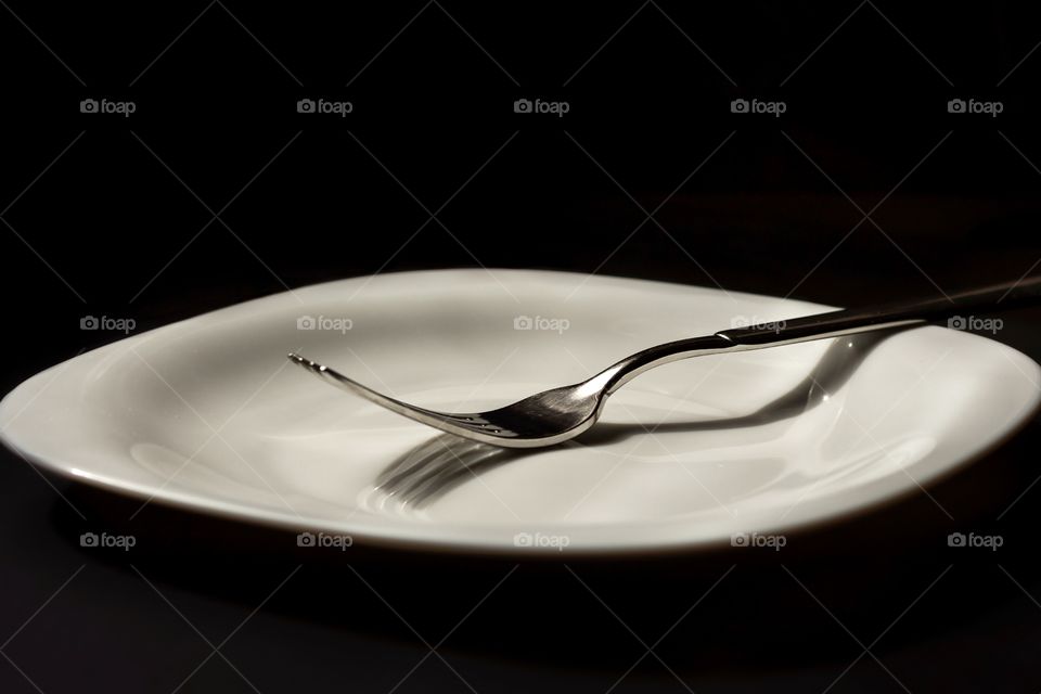 Fork and white plate