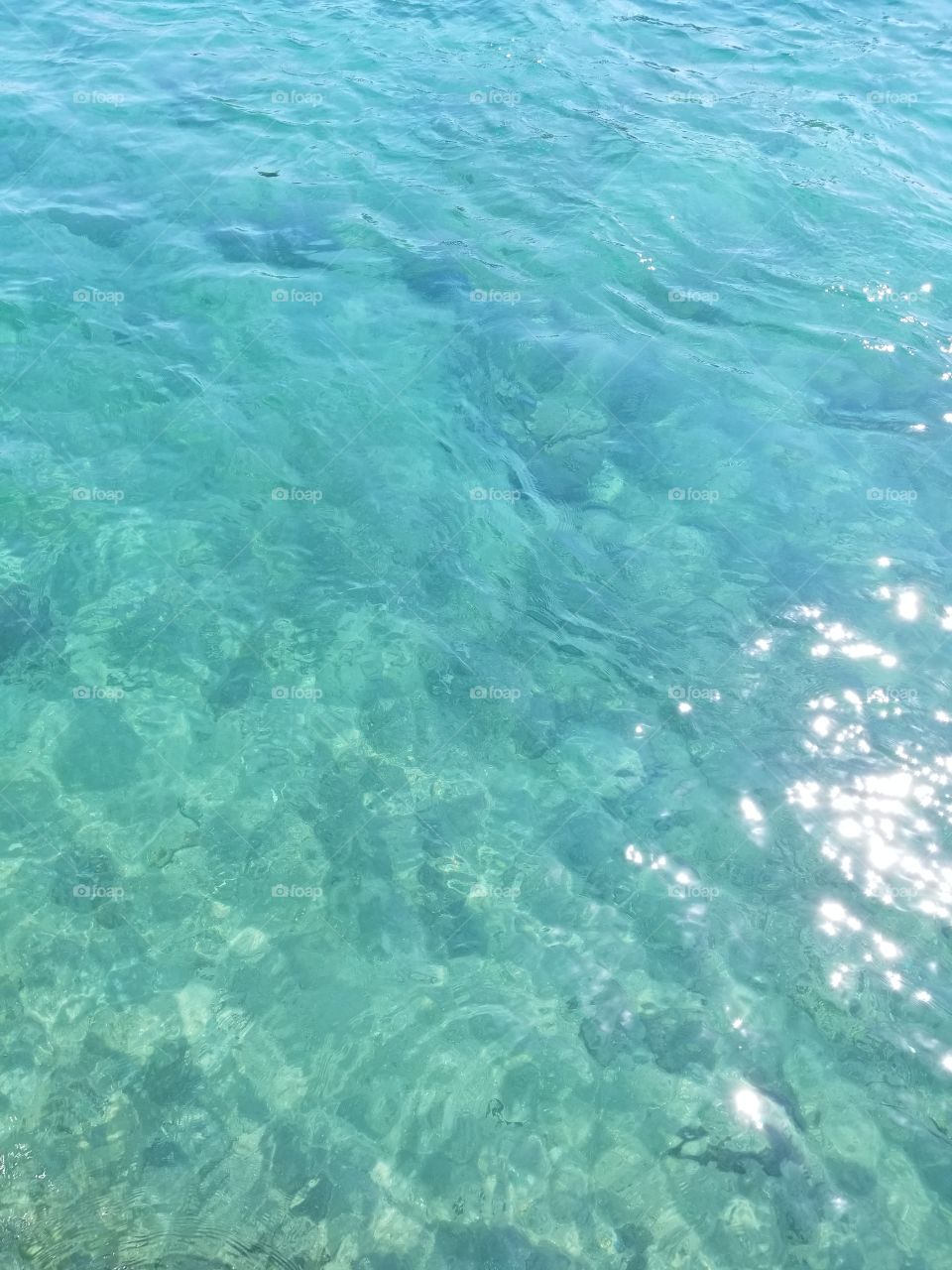 ripples in clear blue ocean water