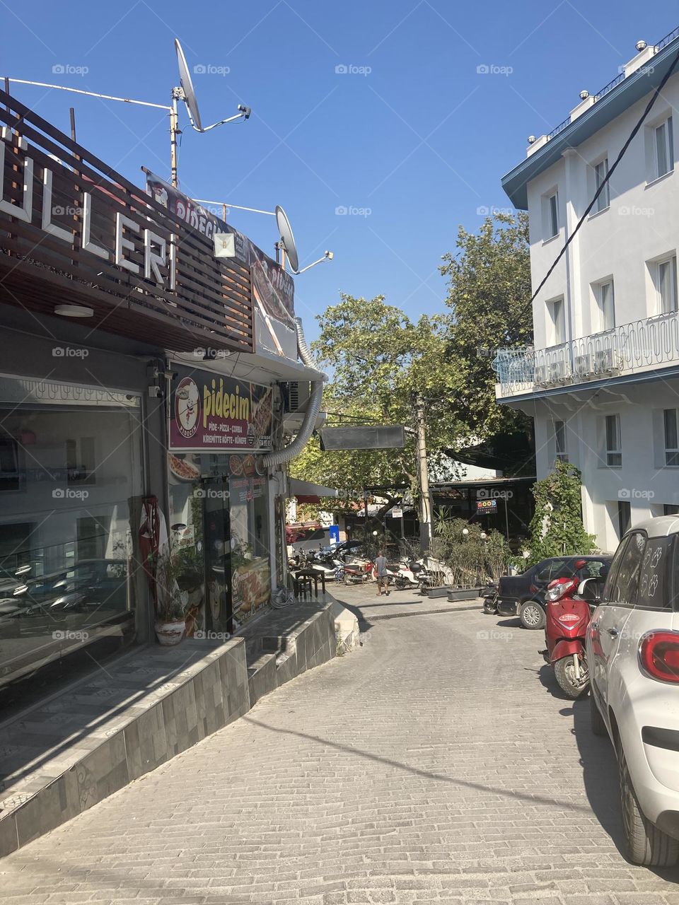 Summertime in Kusadasi, Turkey. Sunny day in charming sunny city. Ocean and blue sky. Colorful lovely city of Turkey. Summer vacation trips are my favorite.