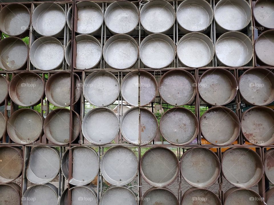 A creative patio wall made out of metal circles at a local business.