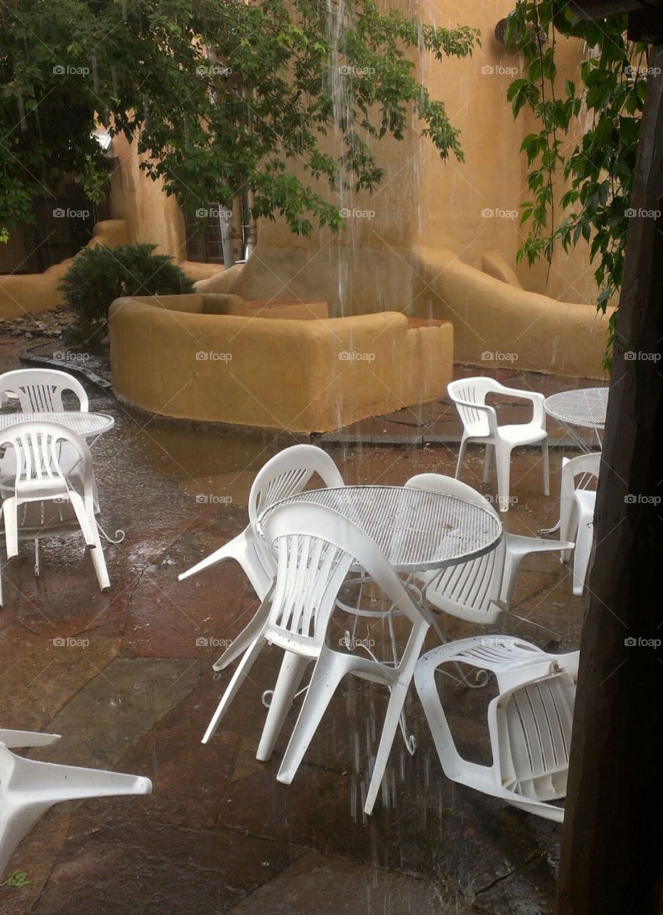 Table and chairs in the rain
