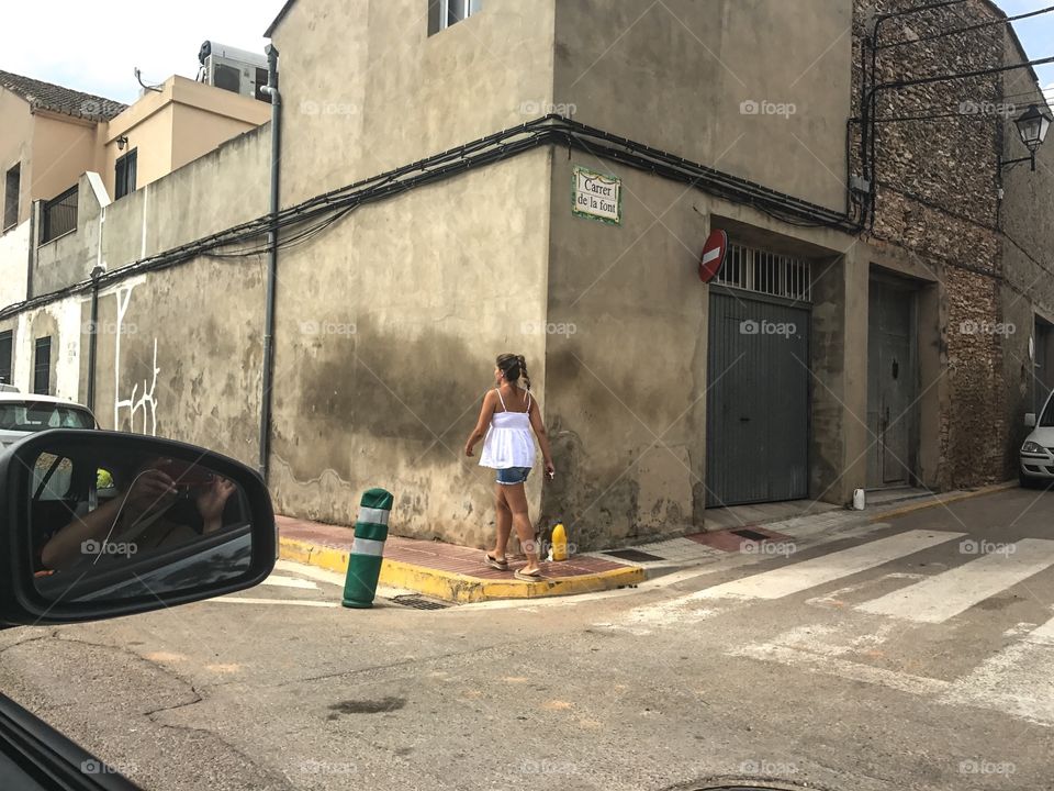 A girl walking in the spanish streets