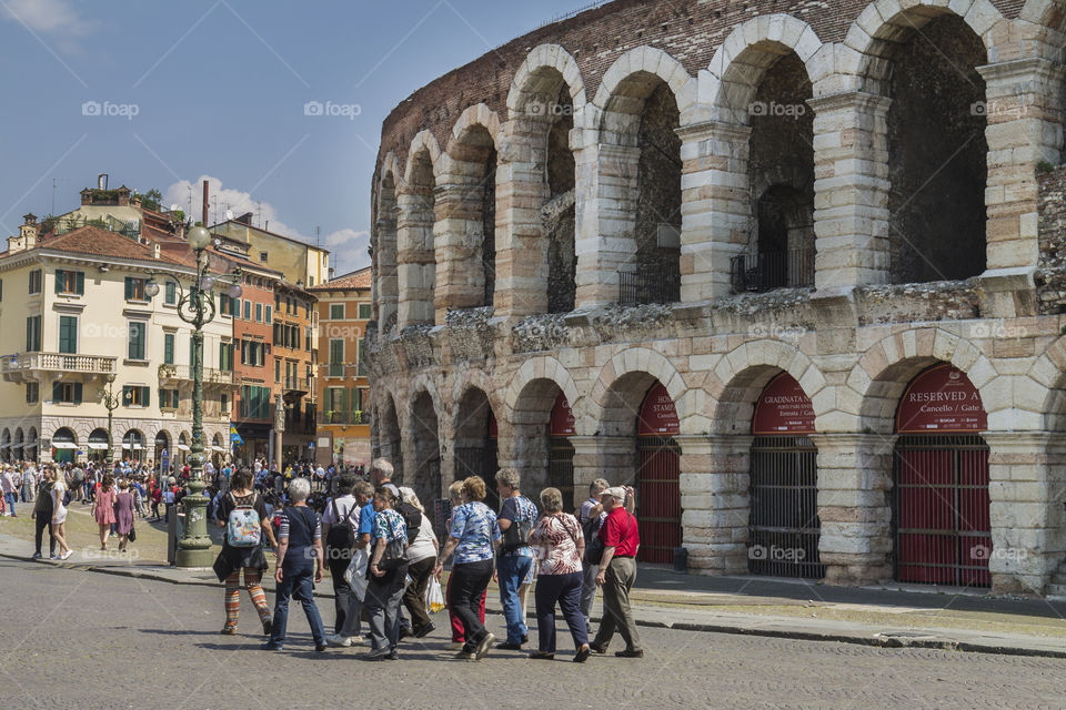 group of helderly tourist outside of Verona Arena