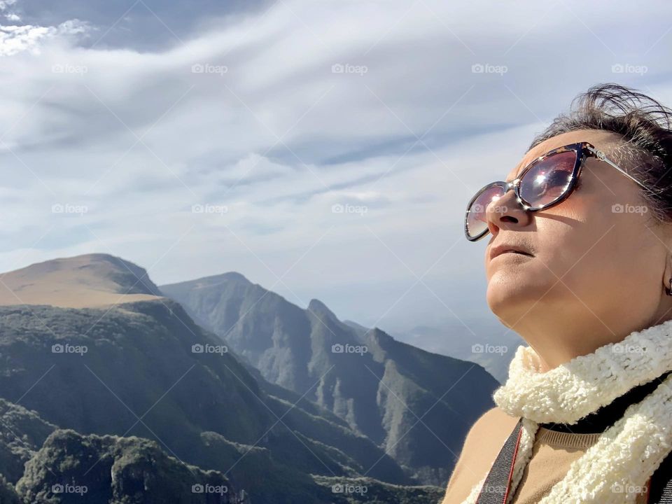 Woman in a peaceful moment, overlooking the canyons