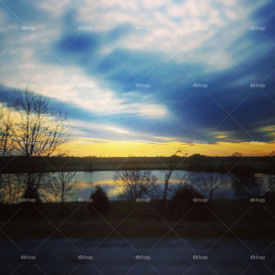 Sunsets and Clouds over the ole fishing pond on the country side.