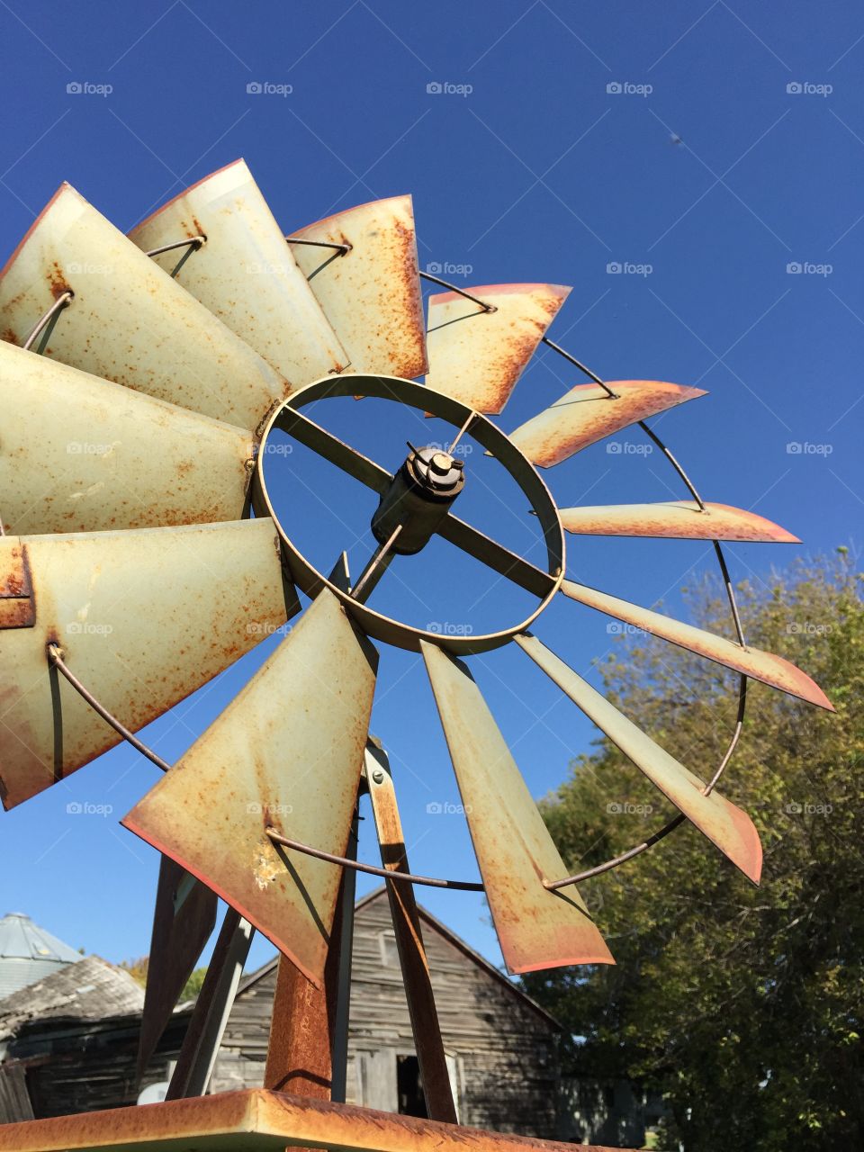 Old Rusty Windmill fan blades on a country farm 