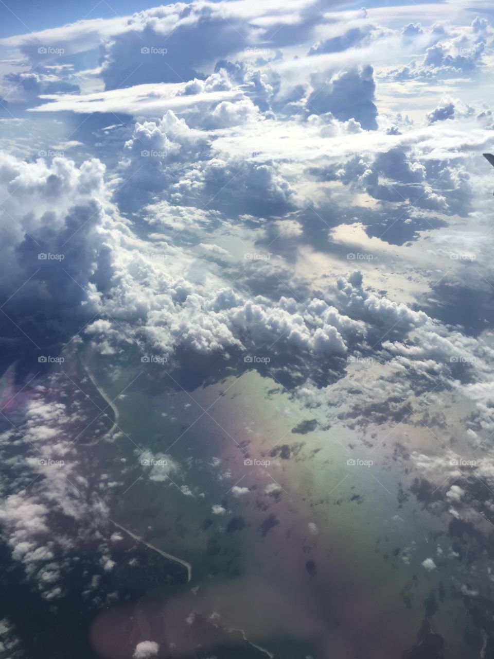 View from an airplane, cloudy skies 