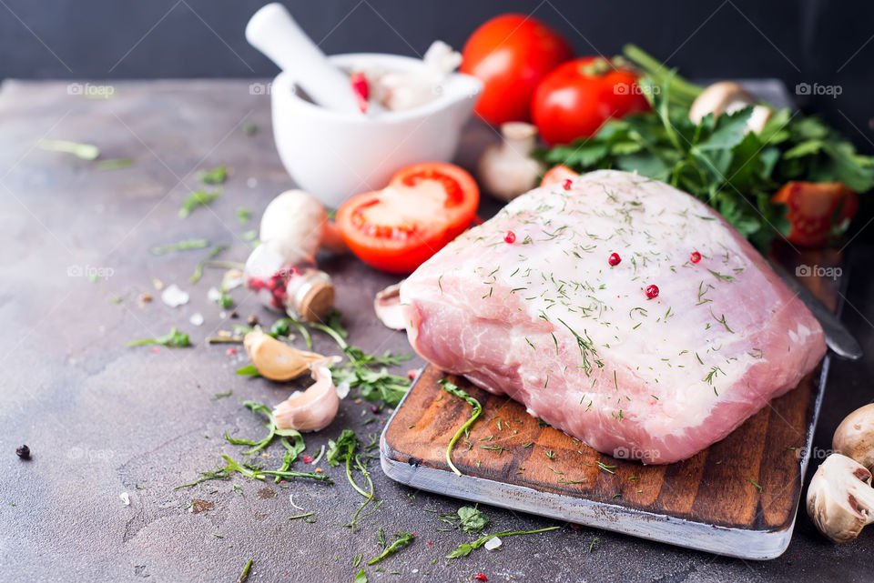 Raw pork meat with ingredients