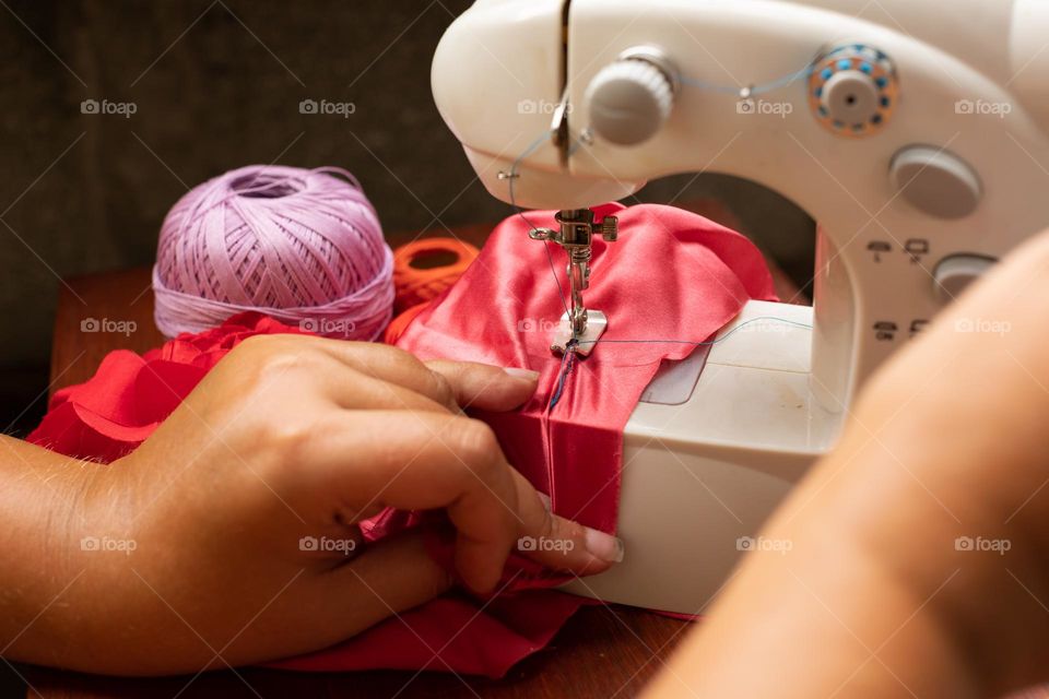 Sewing with a spreading machine