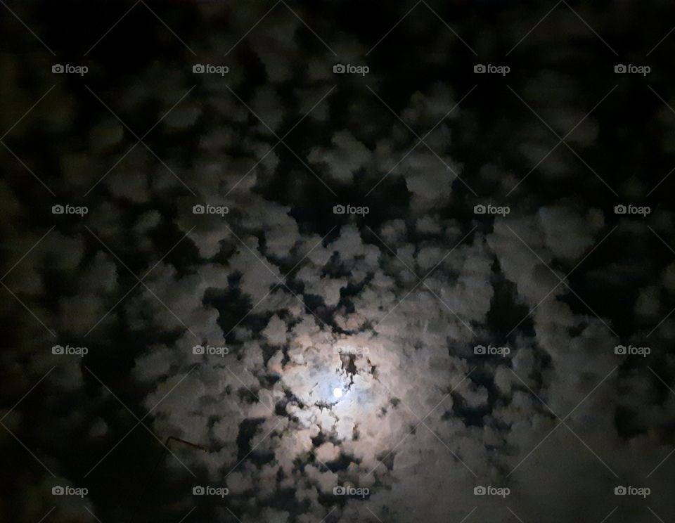 Moon between spiral clouds,night,evening,spiral,mood,clouds,colorful,nature,landscape,sky,cloudy,shining,sunset