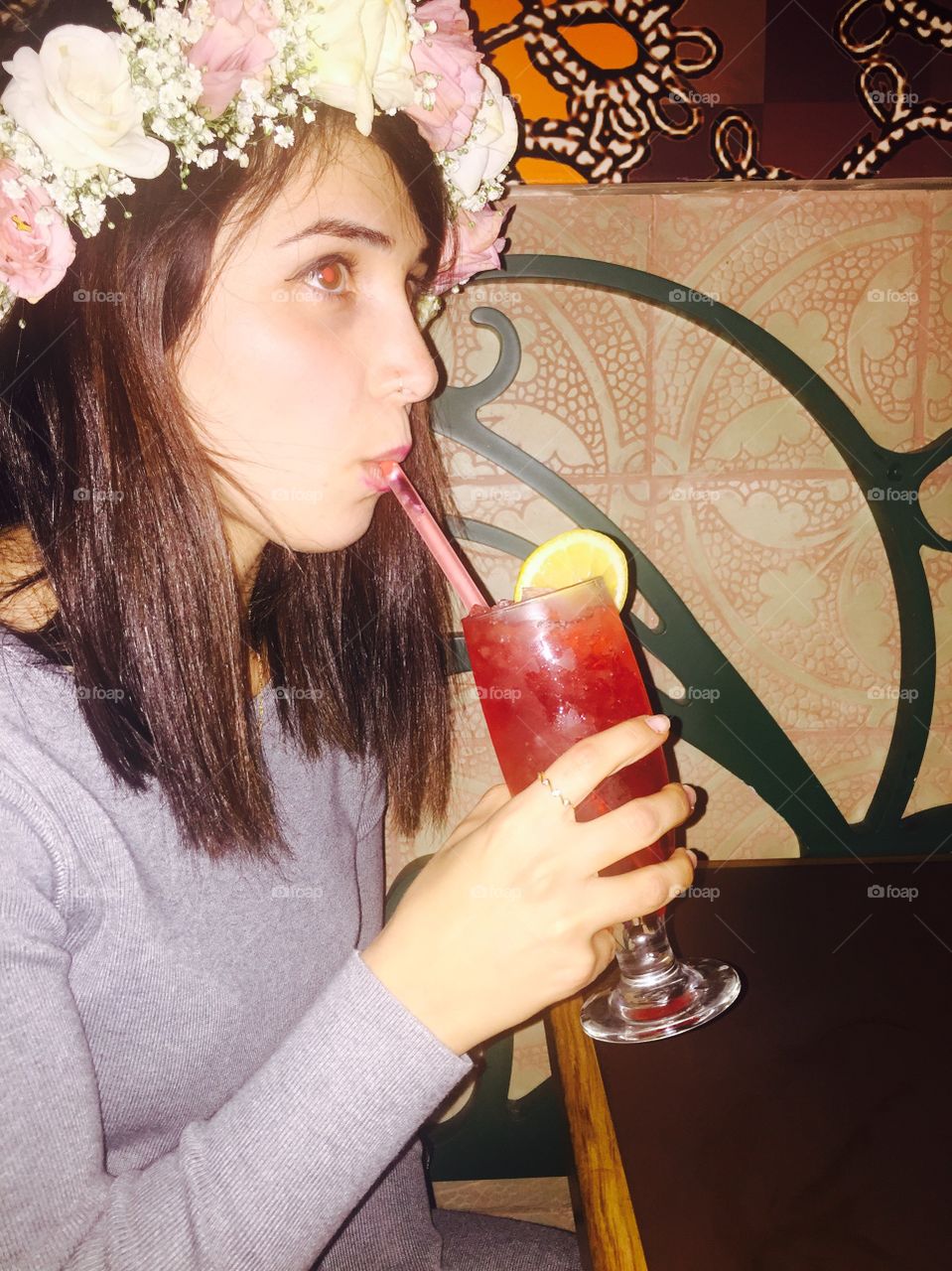 Woman drinking juice in restaurant