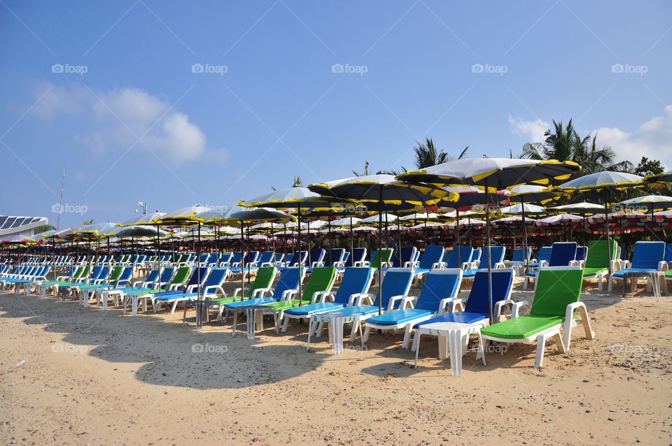 Beach chairs and umbrellas at Ko Lan.