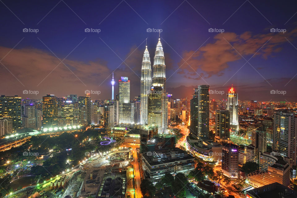 Majestic view of Kuala Lumpur city skyline during blue hour sunset