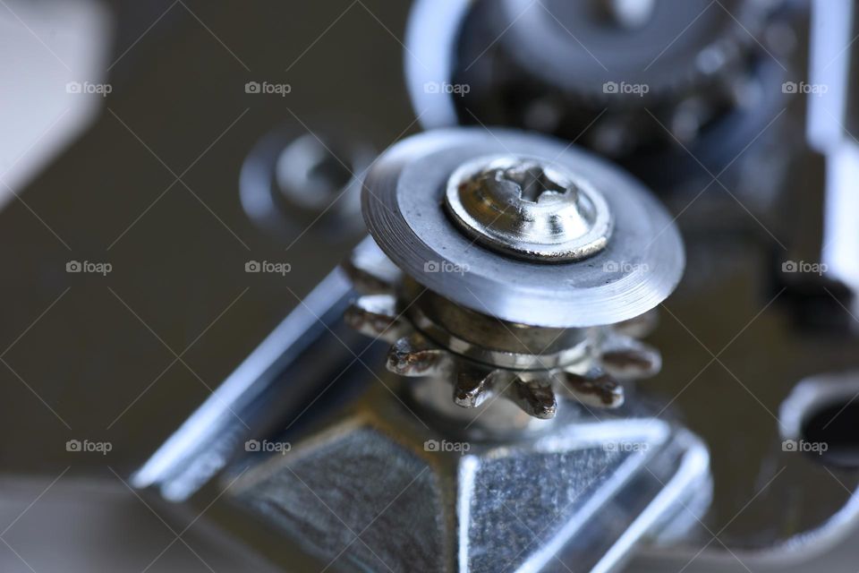 Circular blade of a metal can opener.