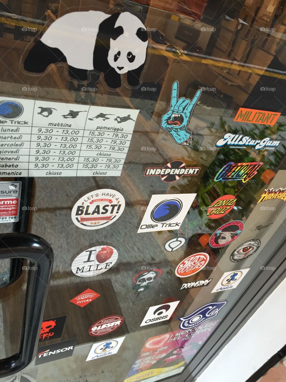 Skate shop door full of stickers