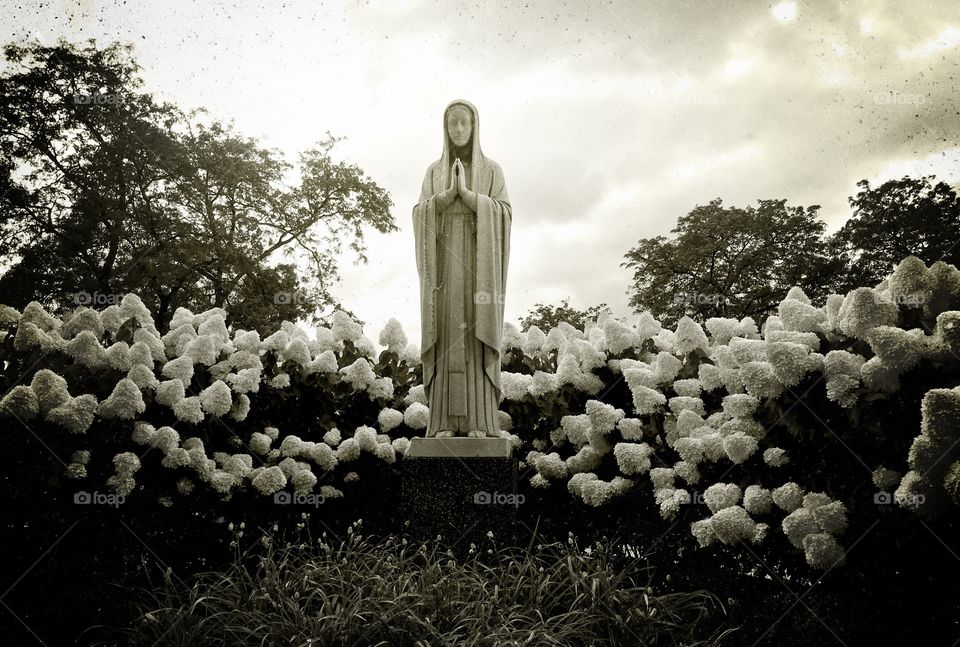 Statue with flowers