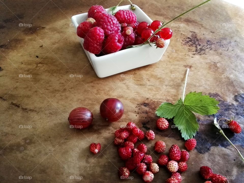 Fresh berries in white bowl