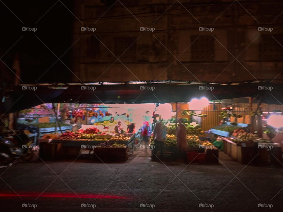 Night view of a traditional store by street. Long exposure, blured and defocused