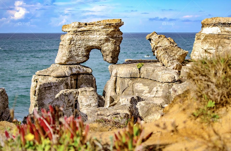 Natural rock formations overlook the Atlantic Ocean at Peniche in Portugal 