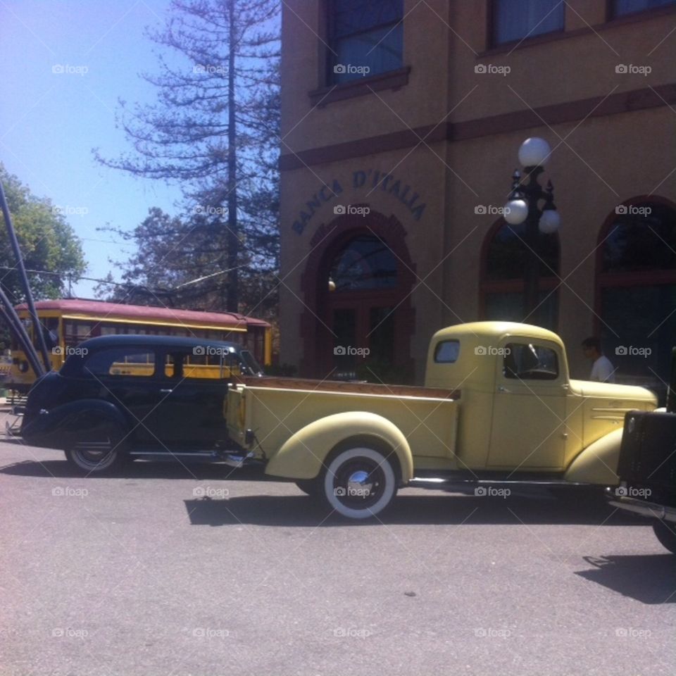 A street at San Jose History Park enjoying a day of reenactments with vintage cars, victory parades, soldiers, music and dancing.