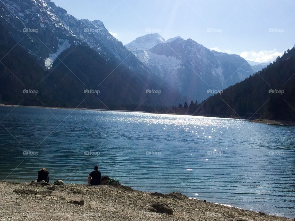 People looking at the scenic view of lake