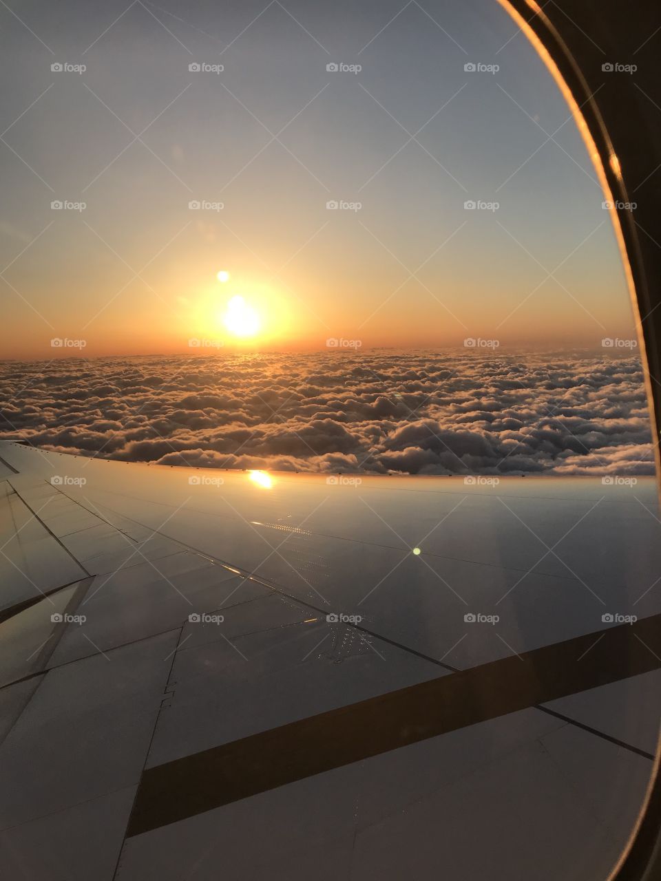 Peaking Sun Over The Clouds 