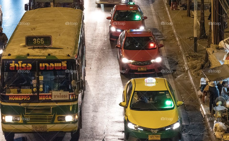 Bus and taxi on the rush hour in the big city