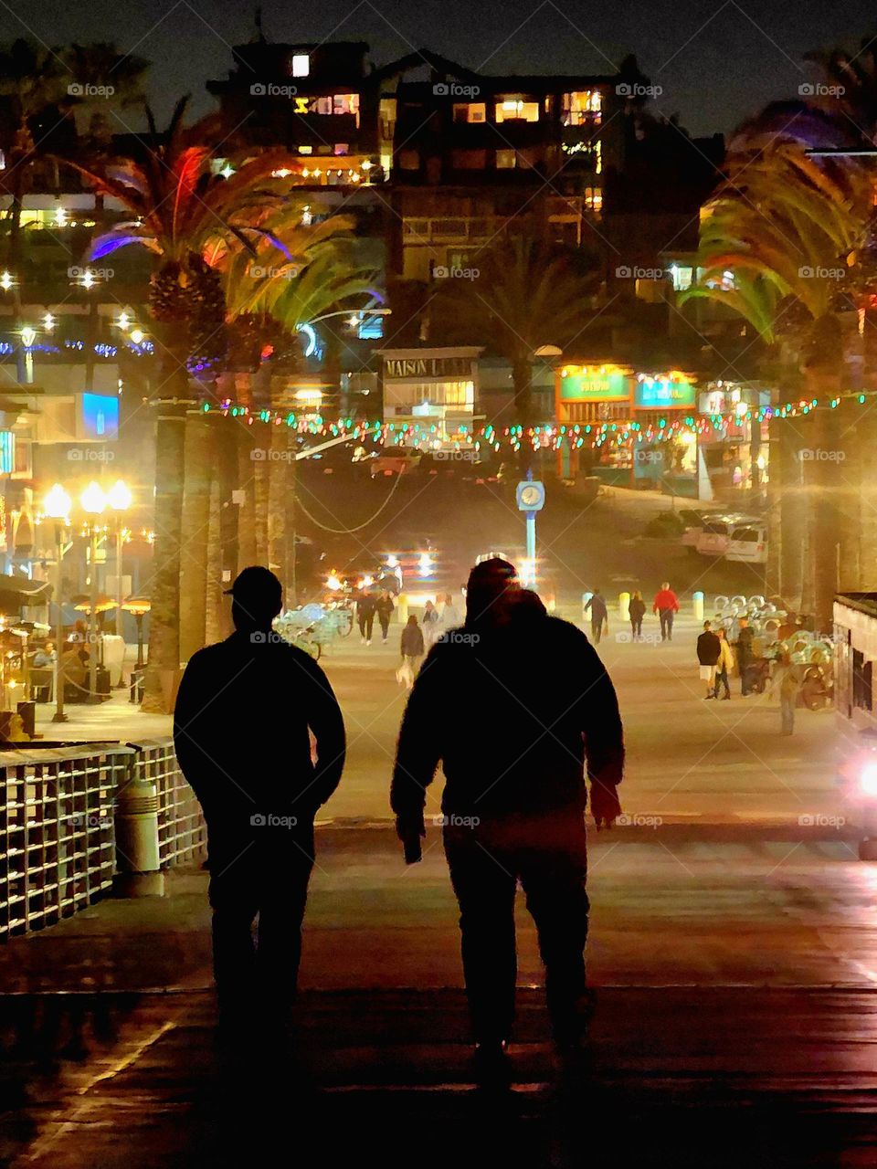 Hermosa Beach pier near Los Angeles on a quiet and cold evening saw very few pedestrians out exploring