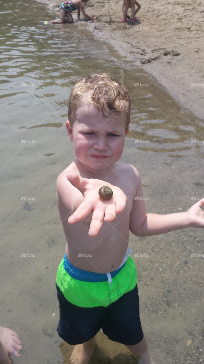 he sold sea shells. my son proudly documenting his first sea shell find