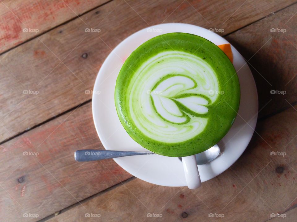 Hot Green coffee in cup 
