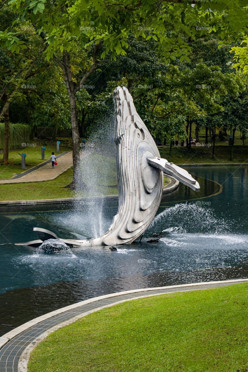 Fountain in shape of a whale leaping from water