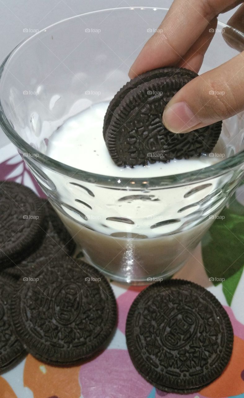 Dunking the cookie in milk