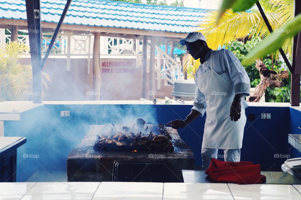 Chef Cooking On The Beach