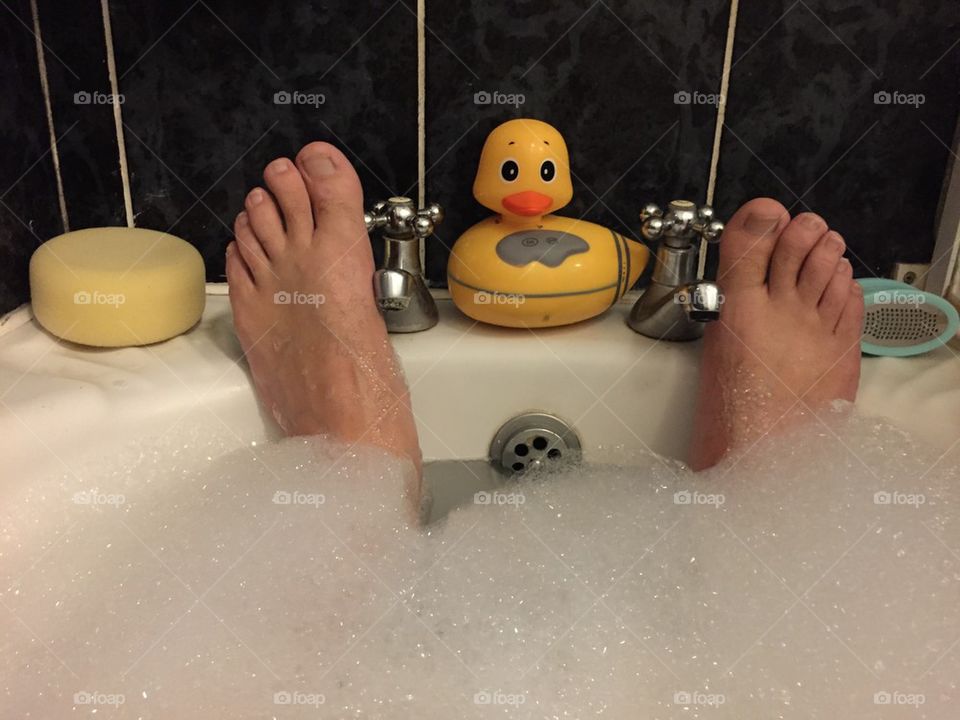 Duck feet. . Relaxing in the bath with a duck radio