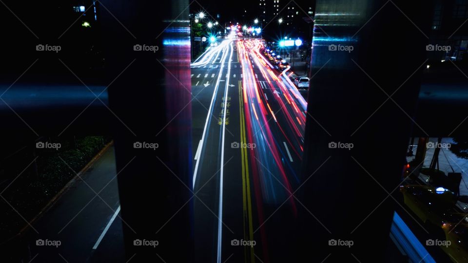 Light trails of traffic at rush hour. Long exposure shot of night time red and white lights