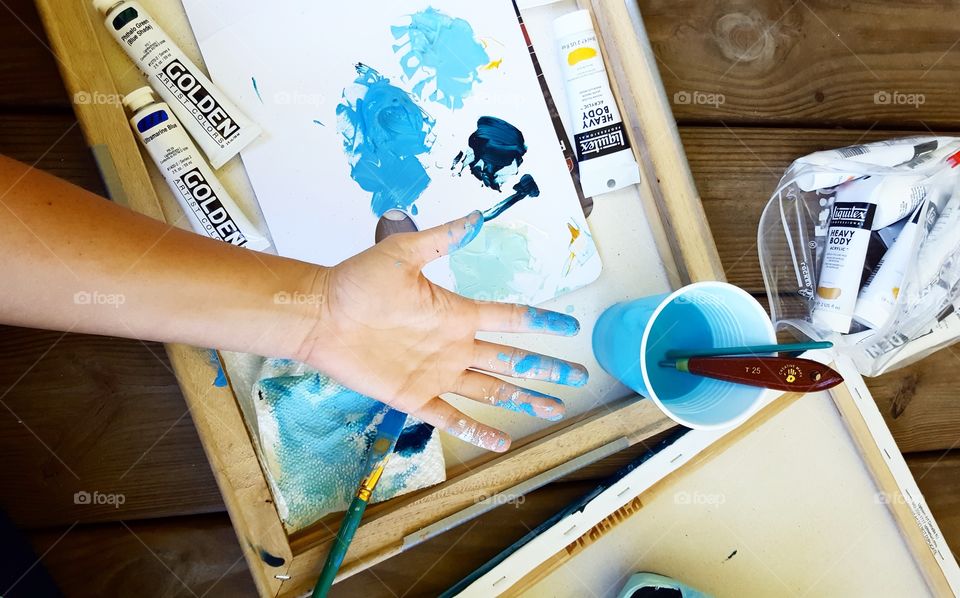 An artist's palette in blue, creative space is anywhere.