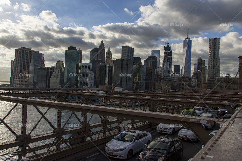 Traffic on Brooklyn Bridge with view on Manhattan skyline