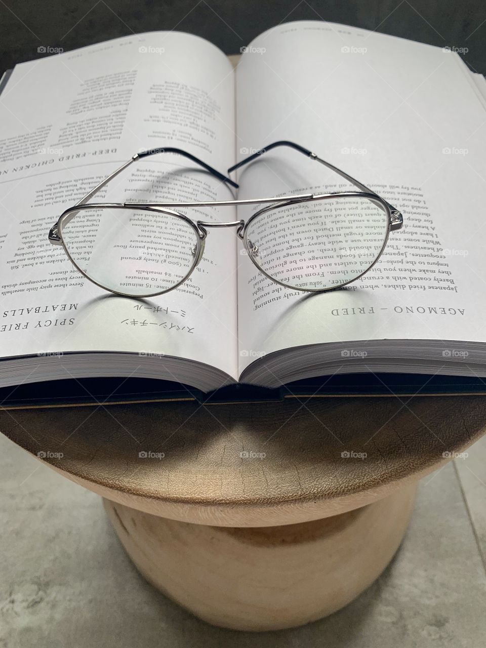 Steel frame reading glasses open book