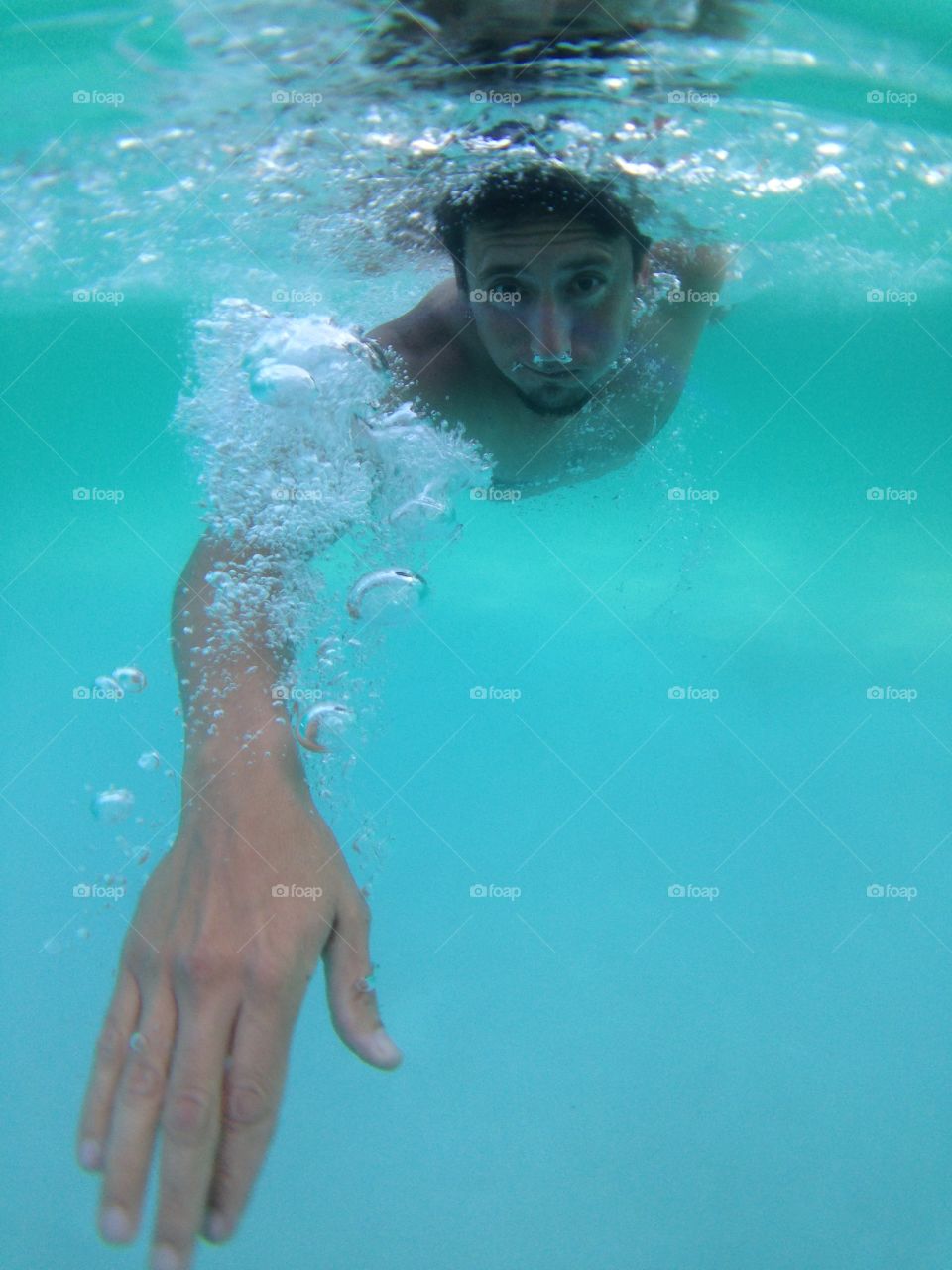 Stroke....stroke..... Underwater view of man swimming