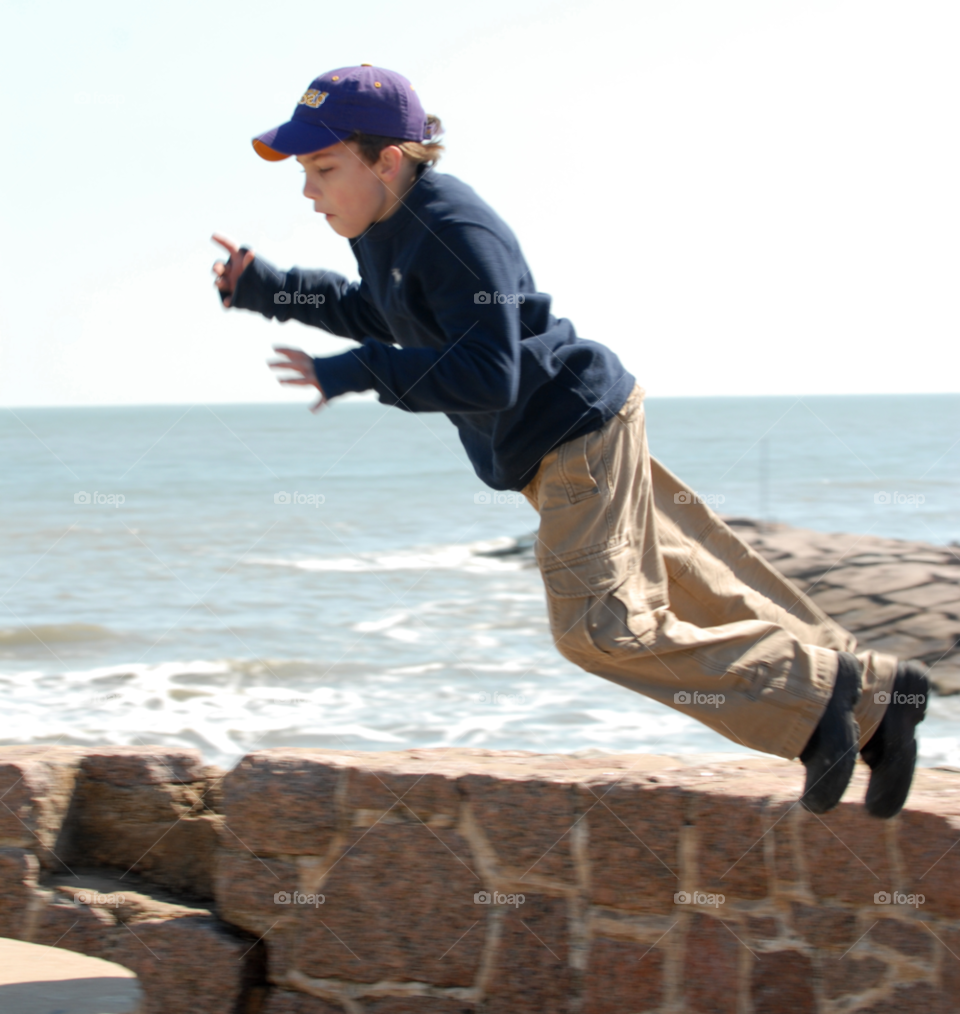 beach fun boy jump by lightanddrawing