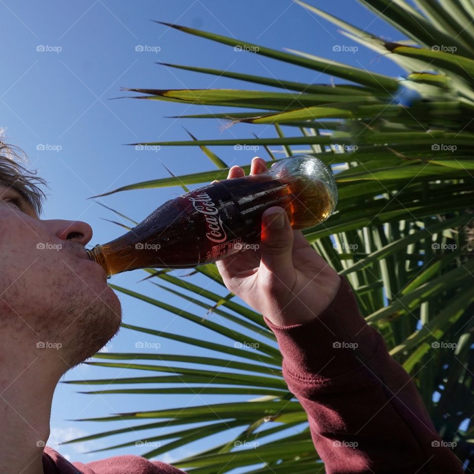 Enjoying a drink of Coca Cola